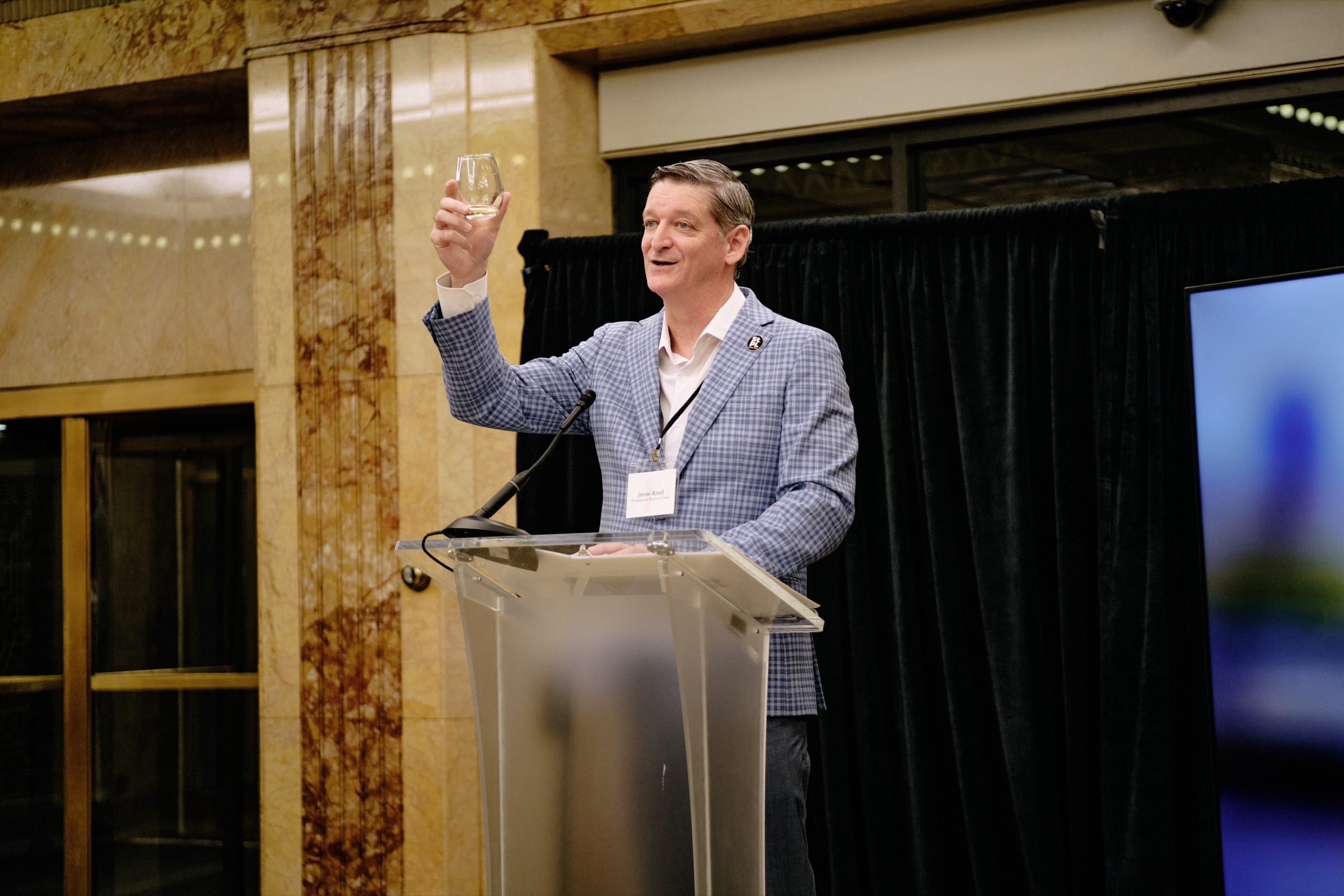 A toast in the marble banking hall at the relighting celebration